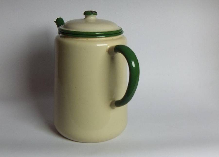 A vintage enamel camping tea or coffee pot