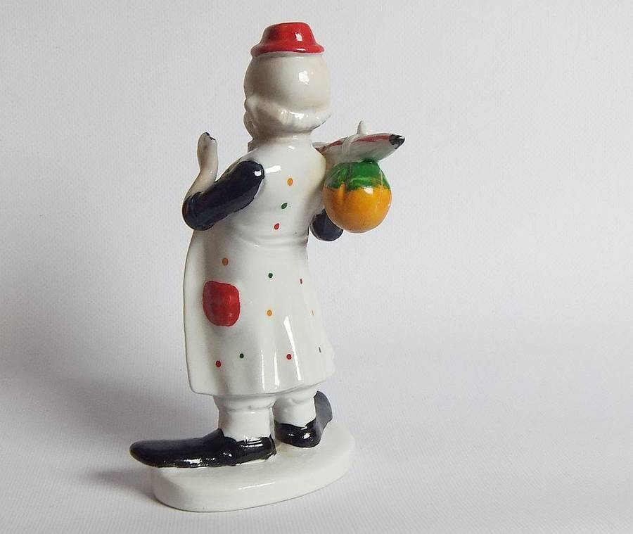 A vintage porcelain cigar smoking clown ornament