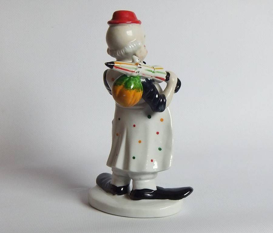 A vintage porcelain cigar smoking clown ornament