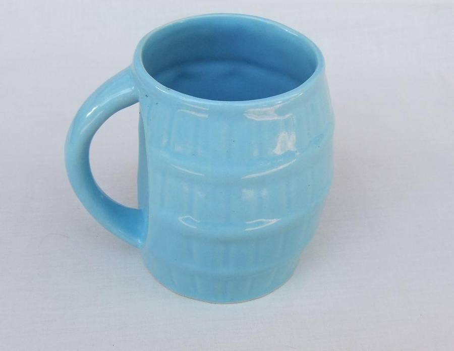 A vintage South African pottery mug with equestrian theme