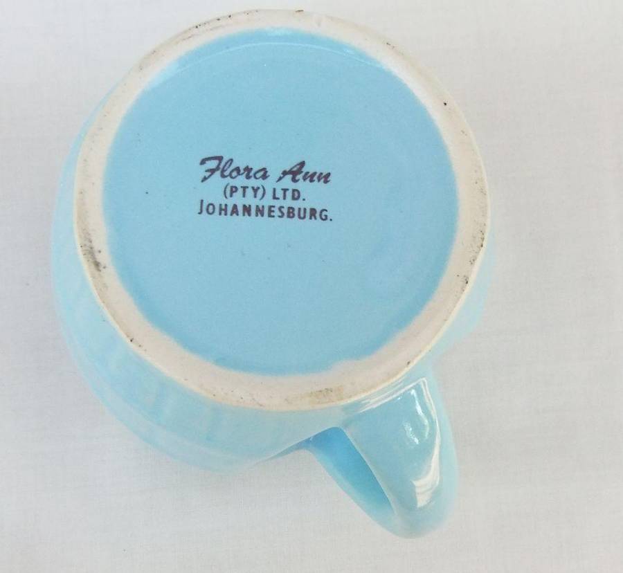 A vintage South African pottery mug with equestrian theme