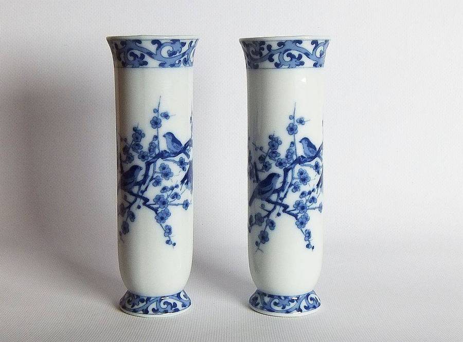 A pair of vintage blue and white porcelain Genuine Imperial Imari vases depicting birds