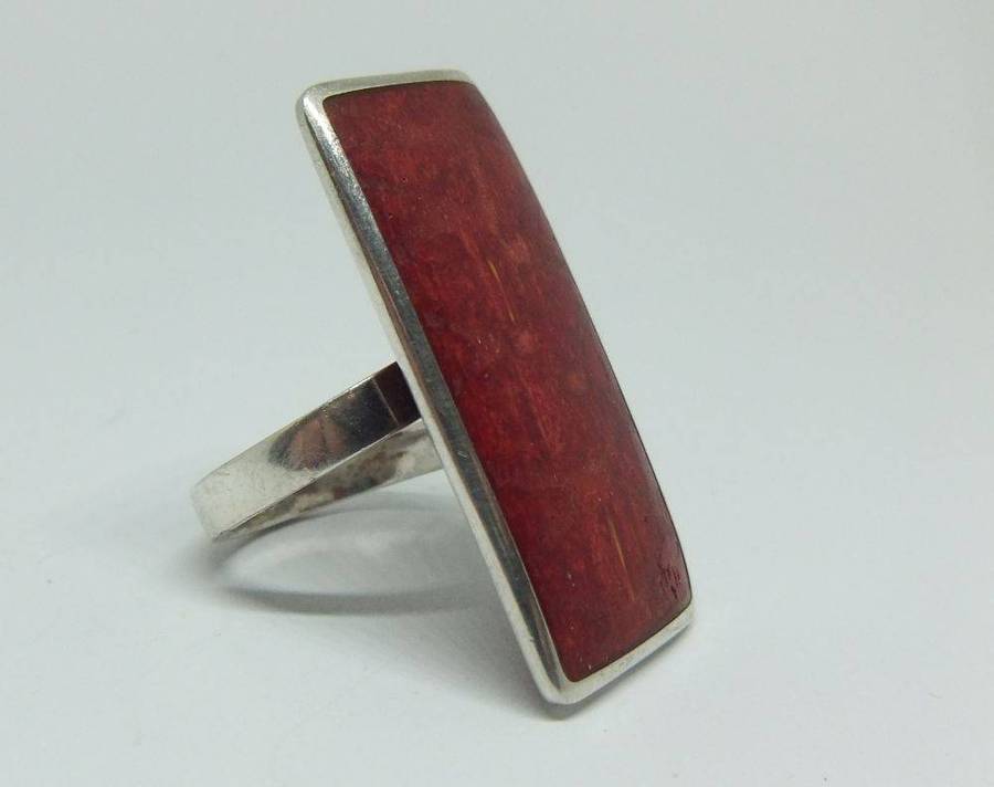 A unique adjustable sterling silver ring set with genuine coral