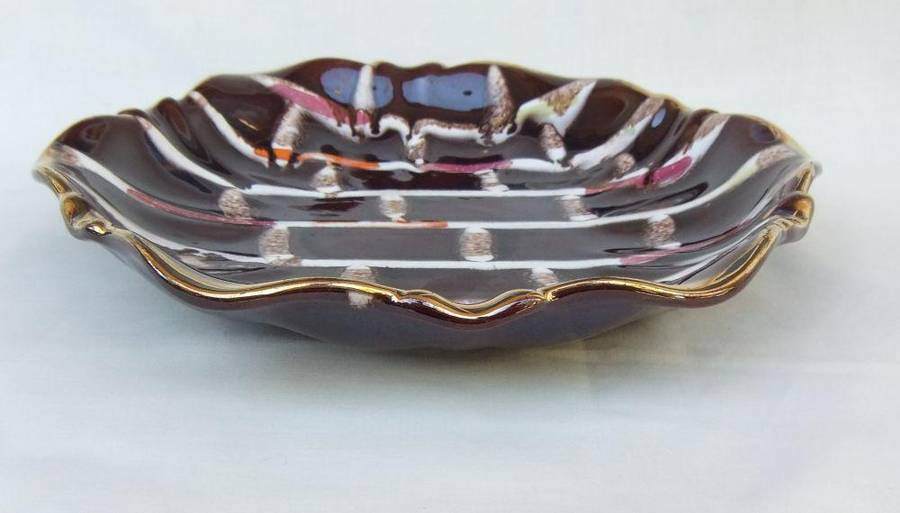 A vintage mid-century hand painted and numbered German pottery snack dish