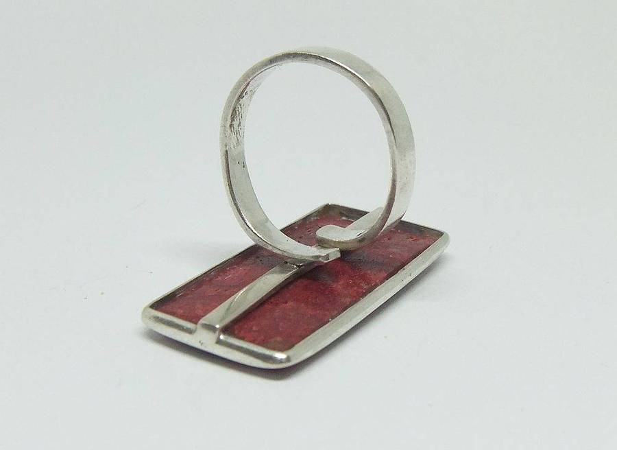 A unique adjustable sterling silver ring set with genuine coral