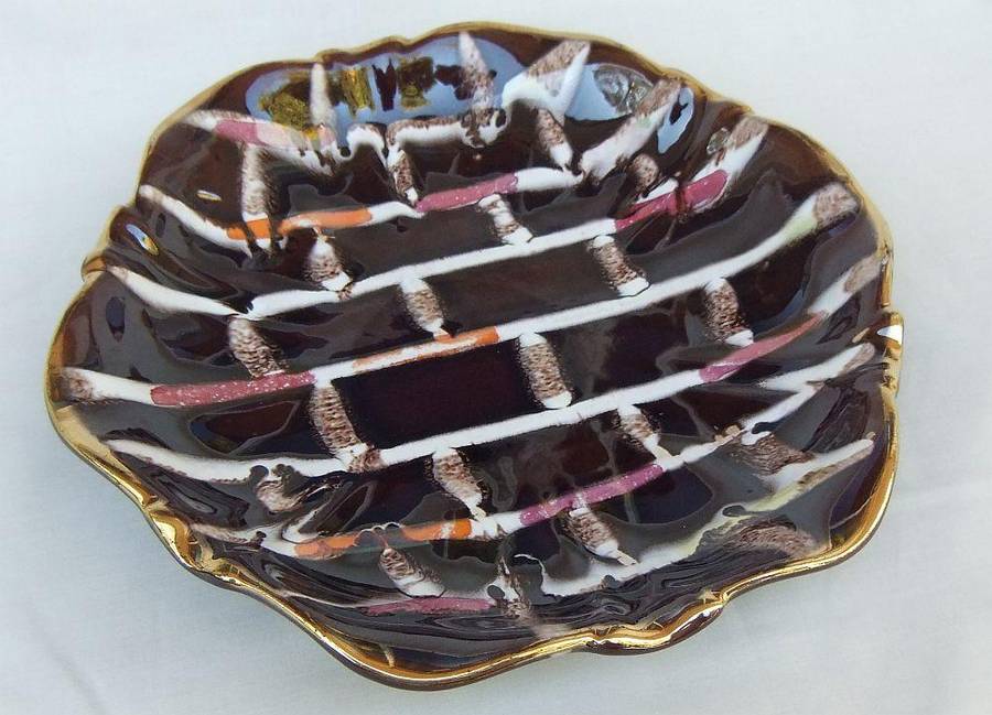 A vintage mid-century hand painted and numbered German pottery snack dish