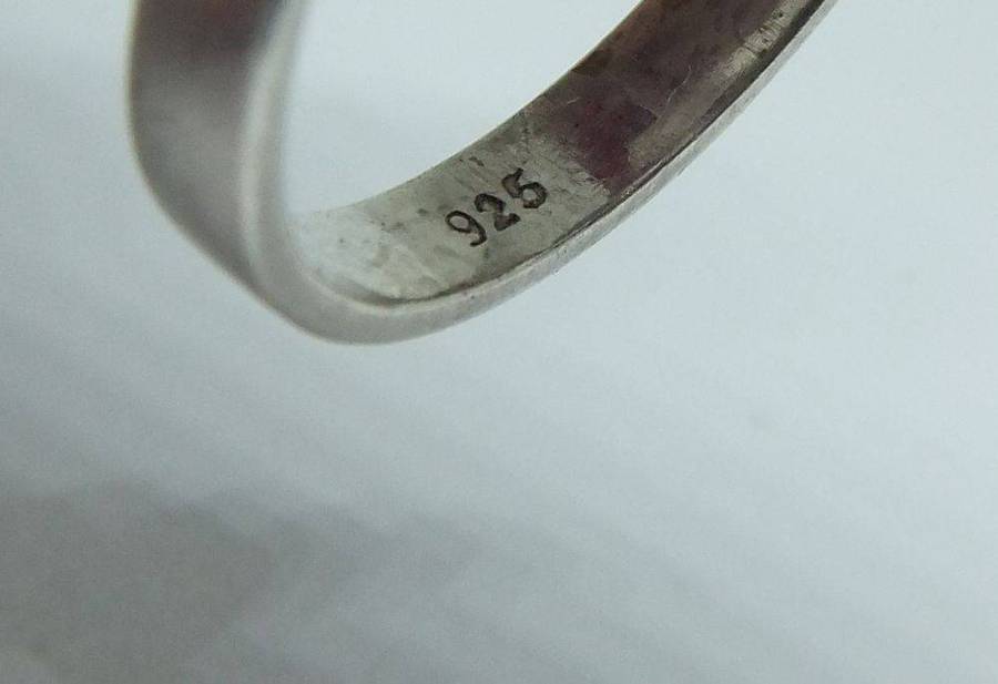 A unique adjustable sterling silver ring set with genuine coral