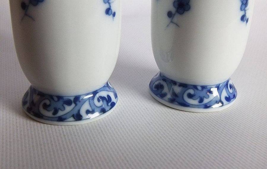 A pair of vintage blue and white porcelain Genuine Imperial Imari vases depicting birds