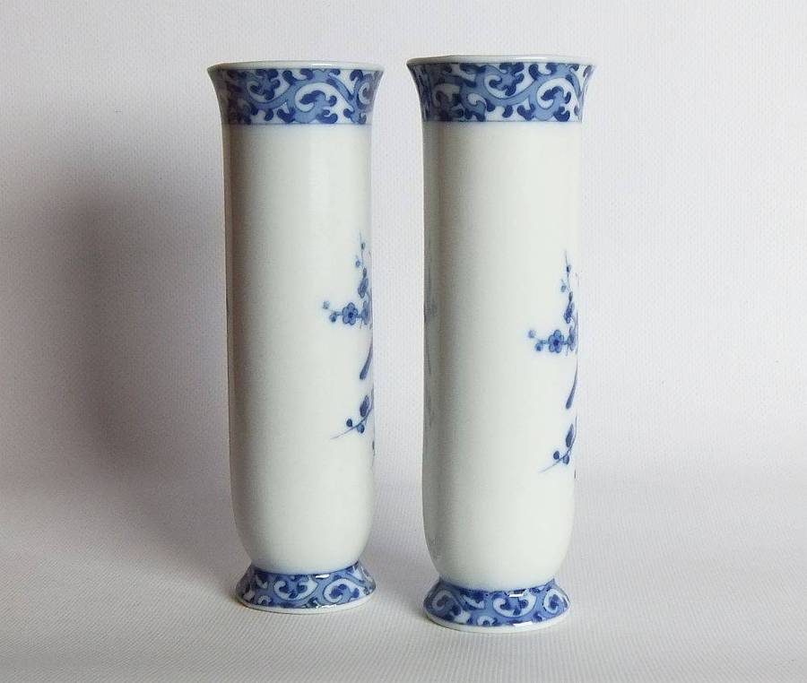 A pair of vintage blue and white porcelain Genuine Imperial Imari vases depicting birds