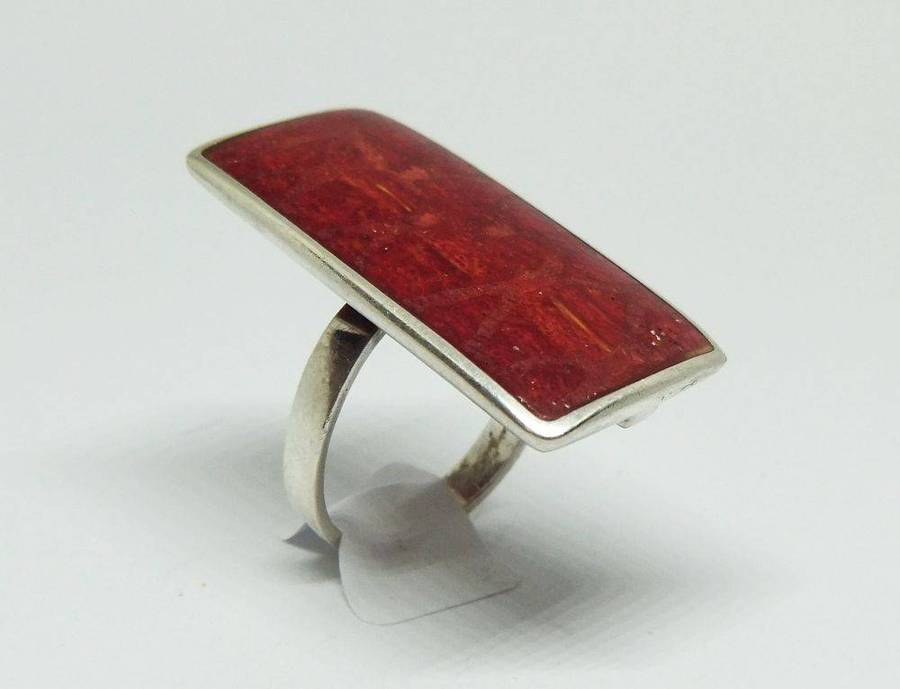 A unique adjustable sterling silver ring set with genuine coral