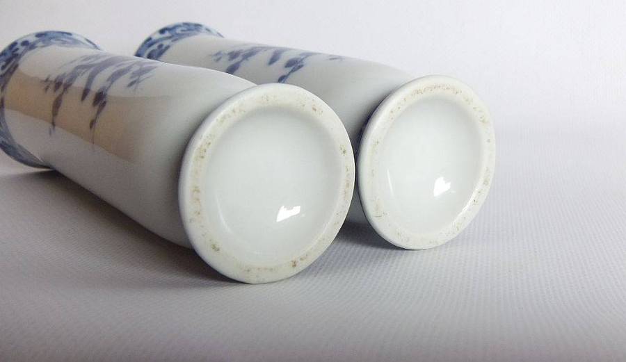 A pair of vintage blue and white porcelain Genuine Imperial Imari vases depicting birds