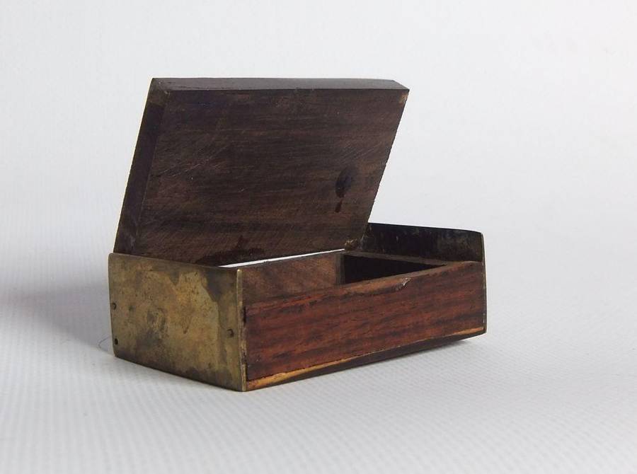 A vintage brass bell with wooden handle and wooden box with brass fittings and inlay