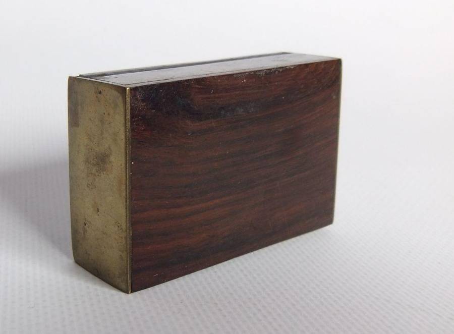 A vintage brass bell with wooden handle and wooden box with brass fittings and inlay