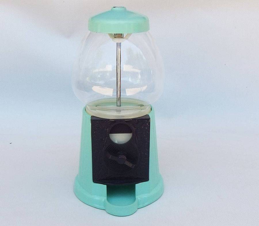 An awesome vintage look , glass , plastic and metal gumball machine in excellent condition