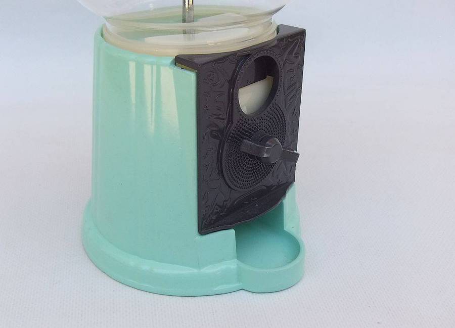 An awesome vintage look , glass , plastic and metal gumball machine in excellent condition