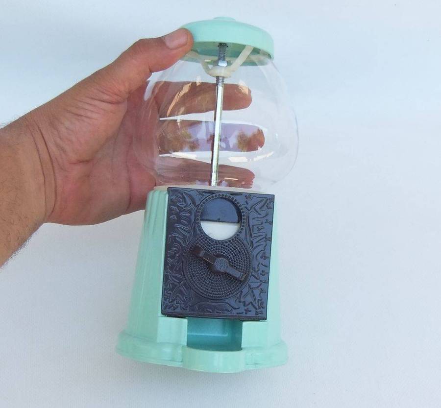 An awesome vintage look , glass , plastic and metal gumball machine in excellent condition