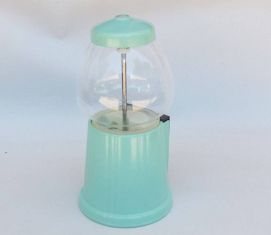 An awesome vintage look , glass , plastic and metal gumball machine in excellent condition