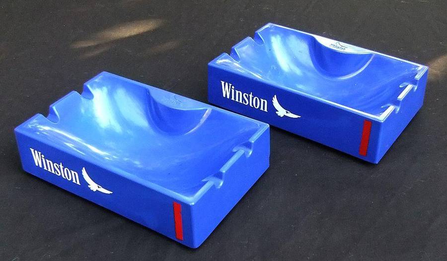 A pair of vintage Winston cigarette advertising ashtrays