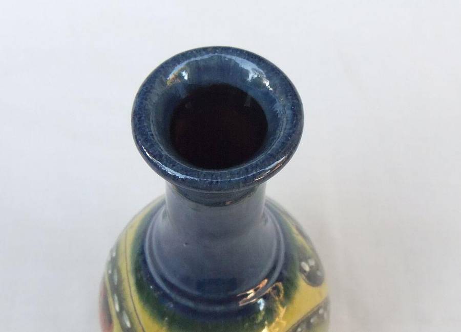 A signed vintage handmade pottery vase with octopus motif