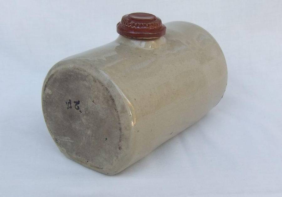 A very old stoneware pottery hot water bottle