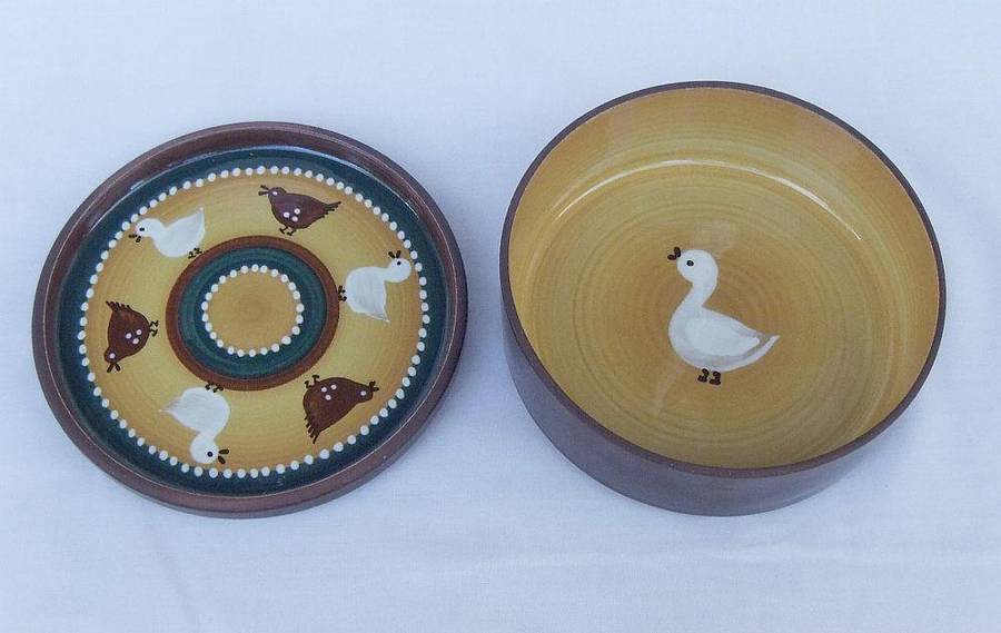 A vintage lidded pottery bowl with chicken and duck motif