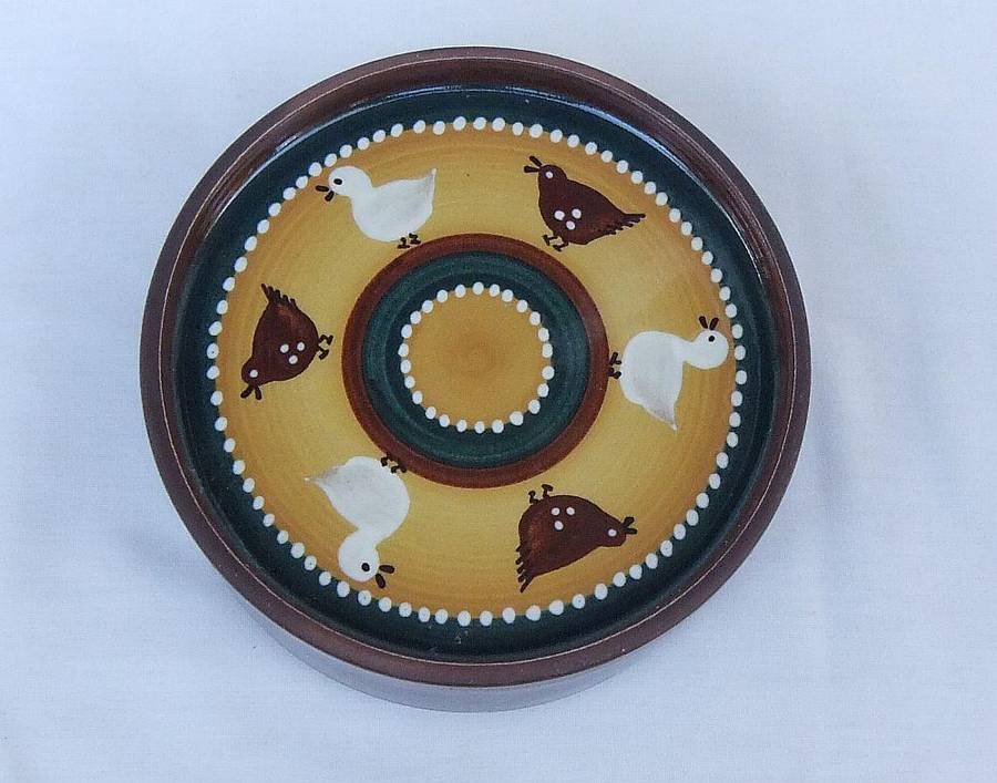 A vintage lidded pottery bowl with chicken and duck motif