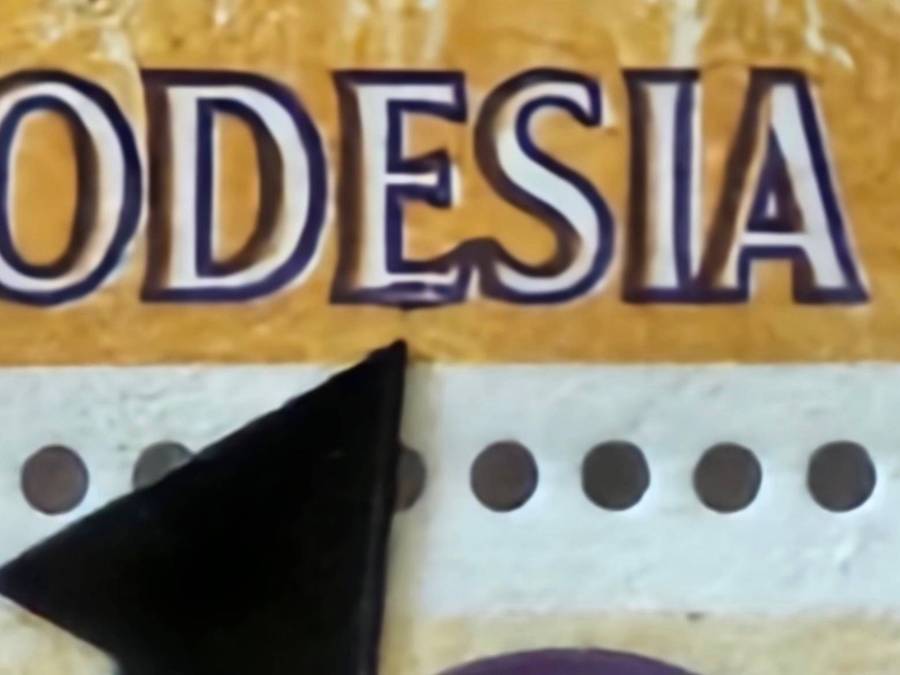 Rhodesia variety hole in buffalo, slight shift causing double effect on wording and broken E.