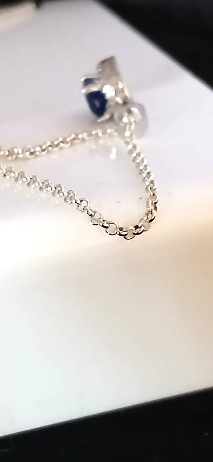 Sterling silver pendant with blue stone on chain