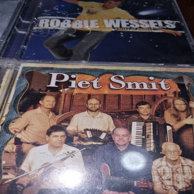 4 x Afrikaanse CD's - Leon Schuster, Klipwerf, Robbie Wessels & Piet Smit