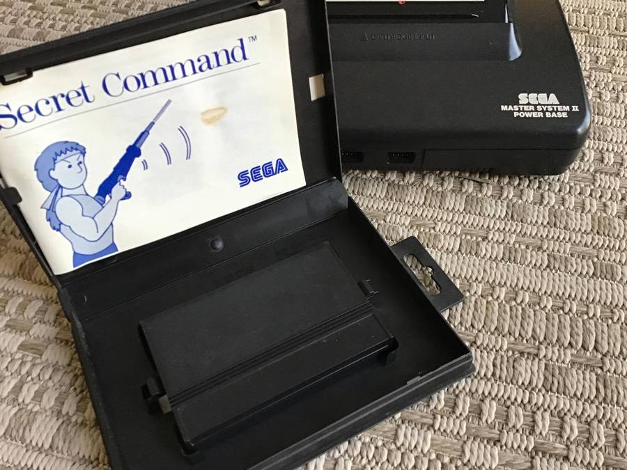 Sega Master System console with game