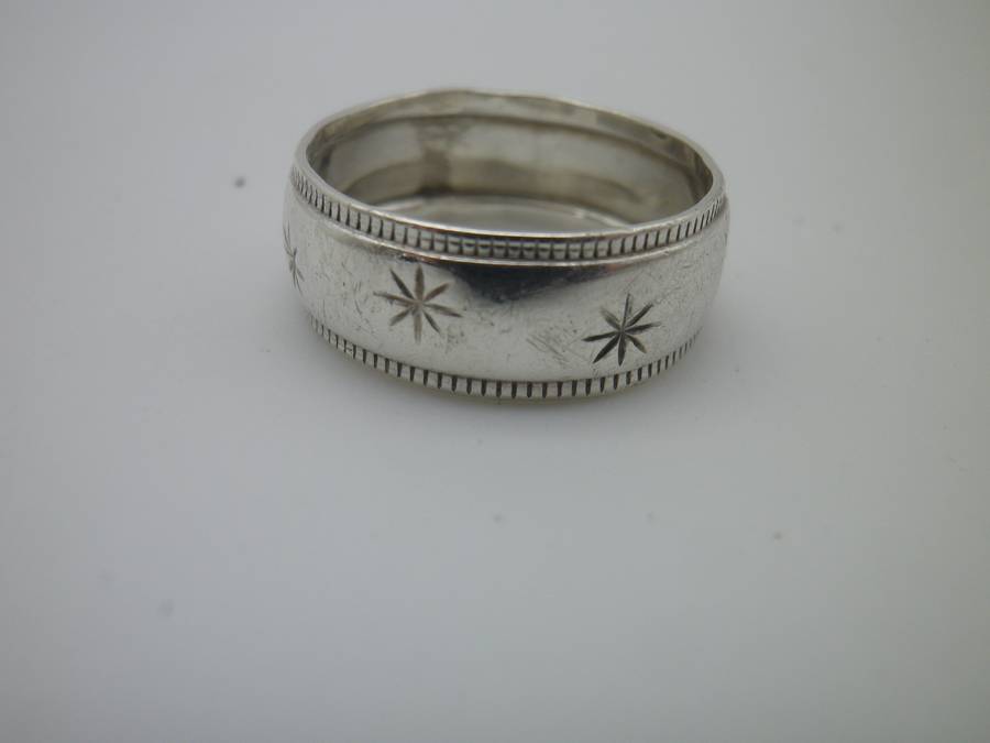 Sterling Silver Vintage Designer Ring.  Well made. Little engraved stars 2.7 grms Size: O 1/2