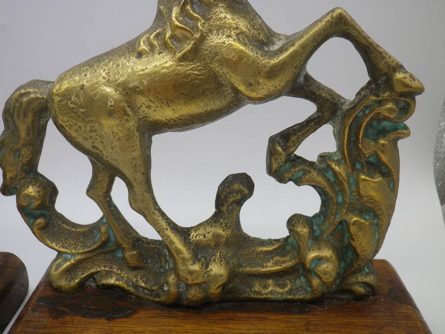 Pair Solid Cast brass Horse bookends on wooden bases. 17.cm x 15cm long
