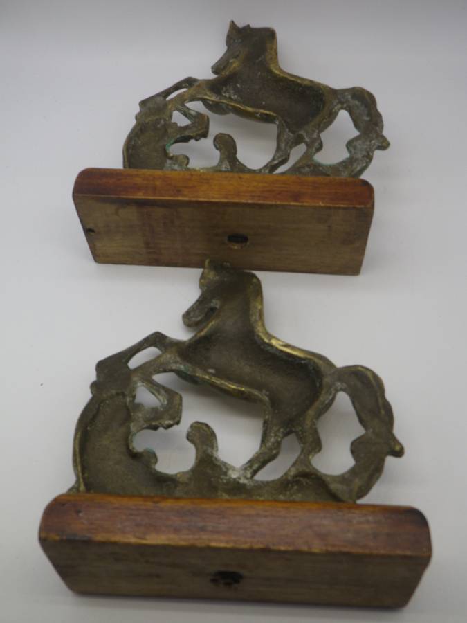 Pair Solid Cast brass Horse bookends on wooden bases. 17.cm x 15cm long