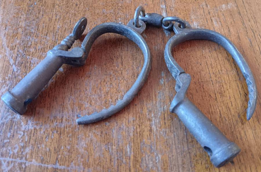 Victorian Hiatt iron handcuffs with key - working
