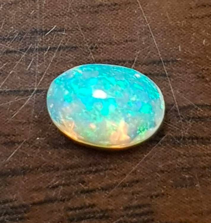 Opal 0.68Cts Oval Facetted 5x7mm Multi Colours Glittering Rainbow 3D! Ethiopian Natural