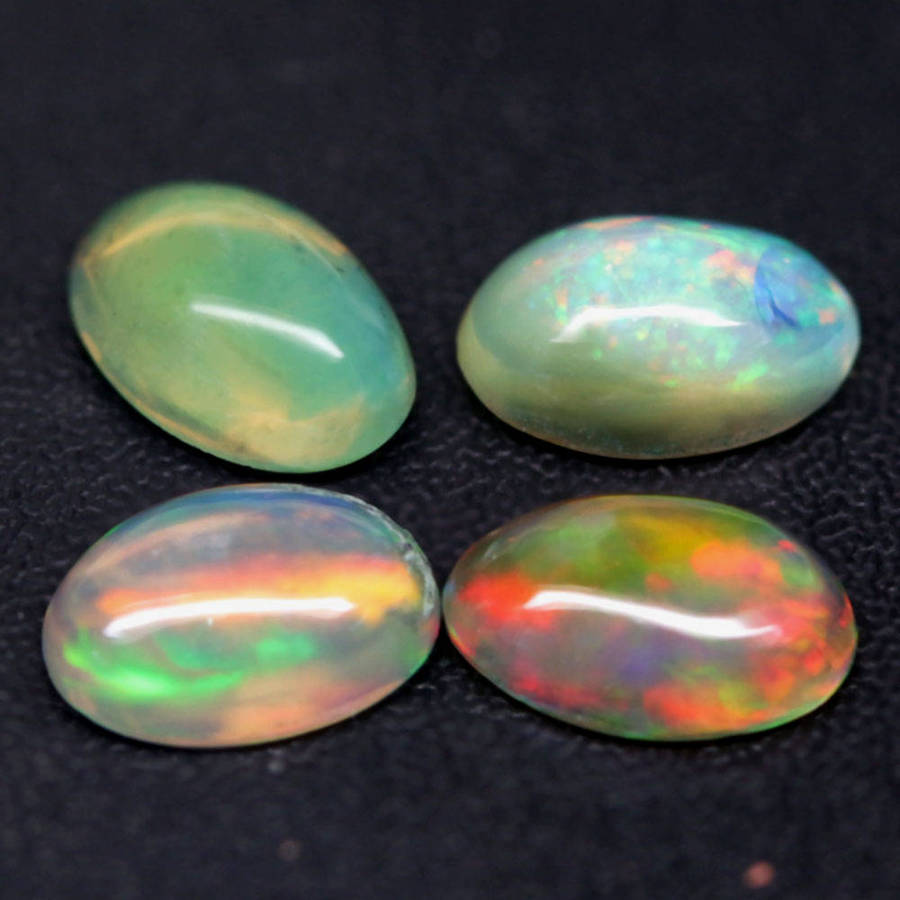 1.21Ct.Opal Oval Cabochon **4 Pieces**Multi Colors Glittering Rainbow 3D! Ethiopian  Natural
