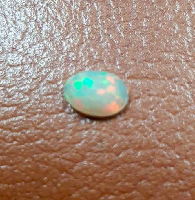 Opal 0.54Cts Oval Facetted 5x7mm Multi Colours Glittering Rainbow 3D! Ethiopian Natural