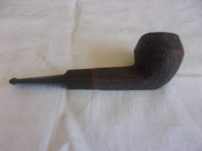 4 Vintage quality smoking pipes and a pipe stand for 1 bid
