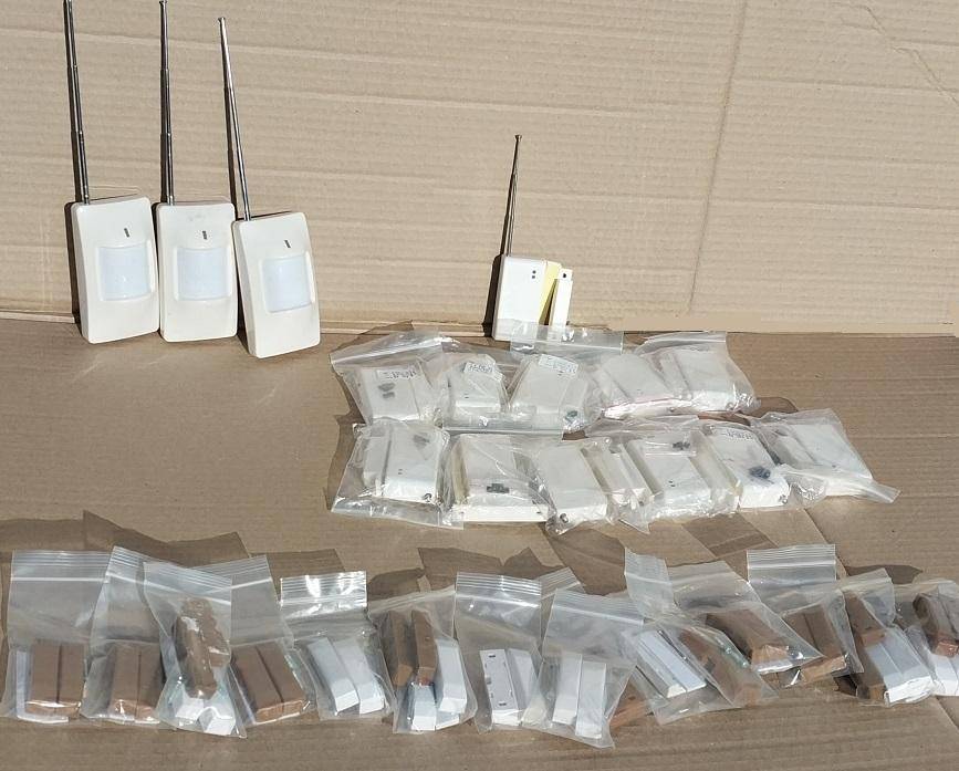 Home GSM alarm system with wireless sensors and wired switches