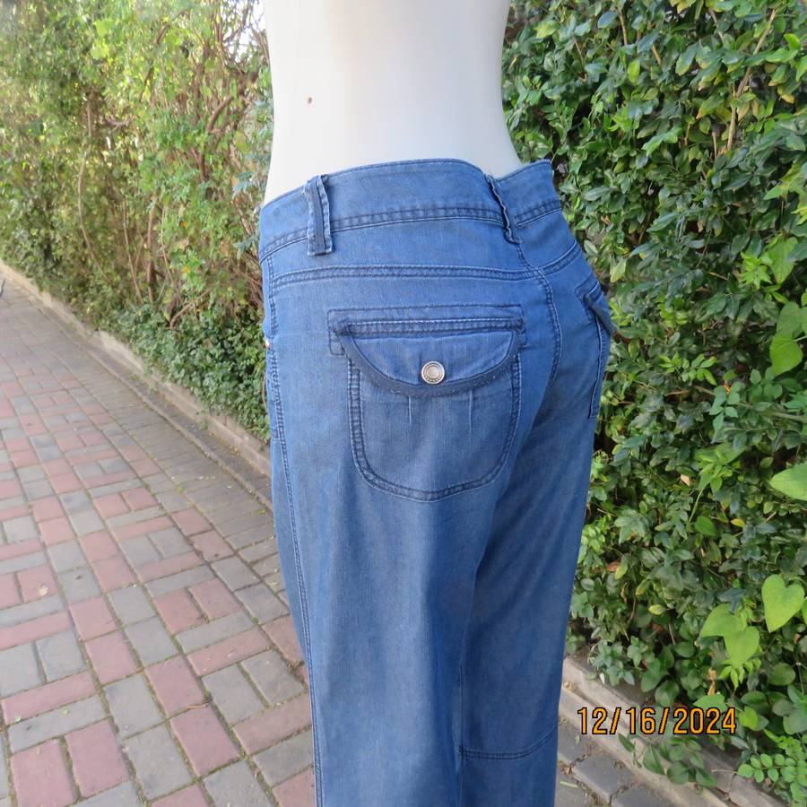 Amazing light weight blue denim jeans by KELSO size 36. Pretty pockets. Decorative stitching. As new