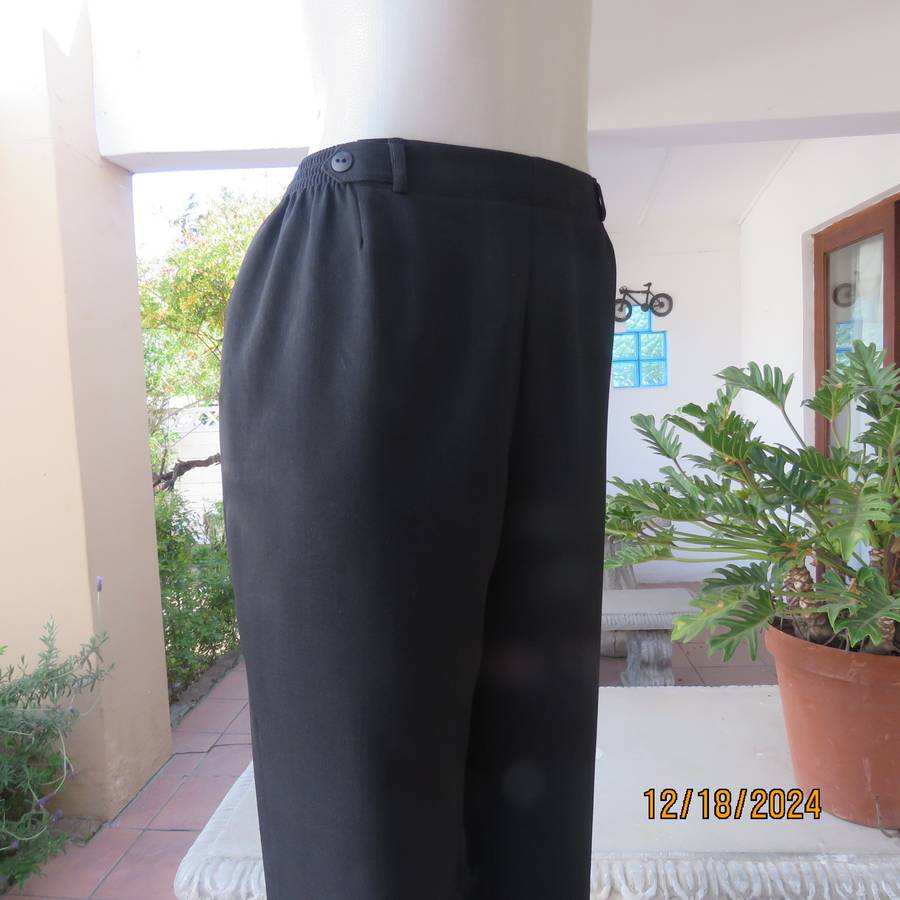 High quality black pants by Bhs from London size 40. In soft polyester. Waist back/sides elasticated