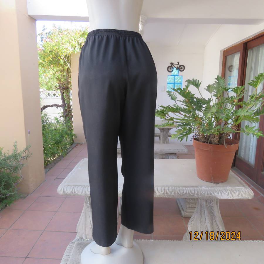 High quality black pants by Bhs from London size 40. In soft polyester. Waist back/sides elasticated