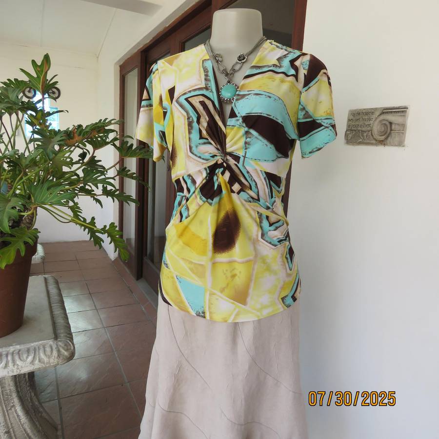 FASHION Express size 38 geometric printed V neck stretch top.
