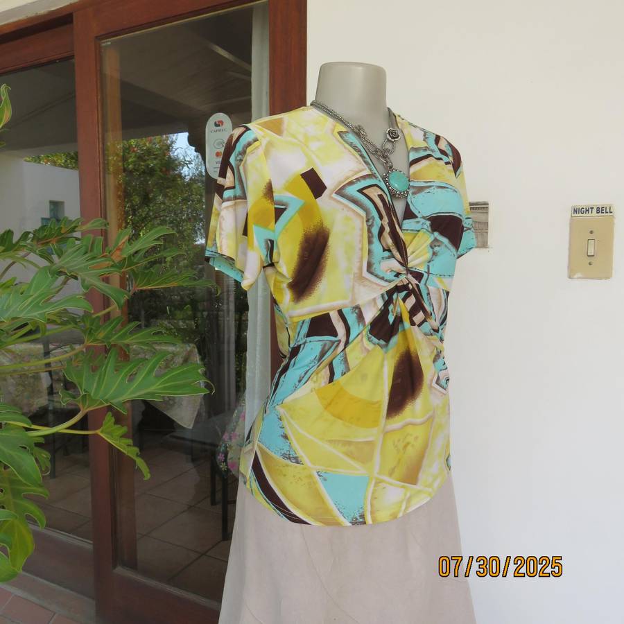 FASHION Express size 38 geometric printed V neck stretch top.