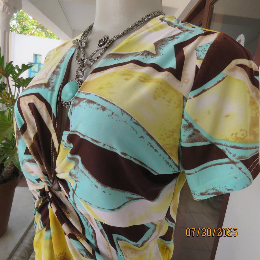 FASHION Express size 38 geometric printed V neck stretch top.