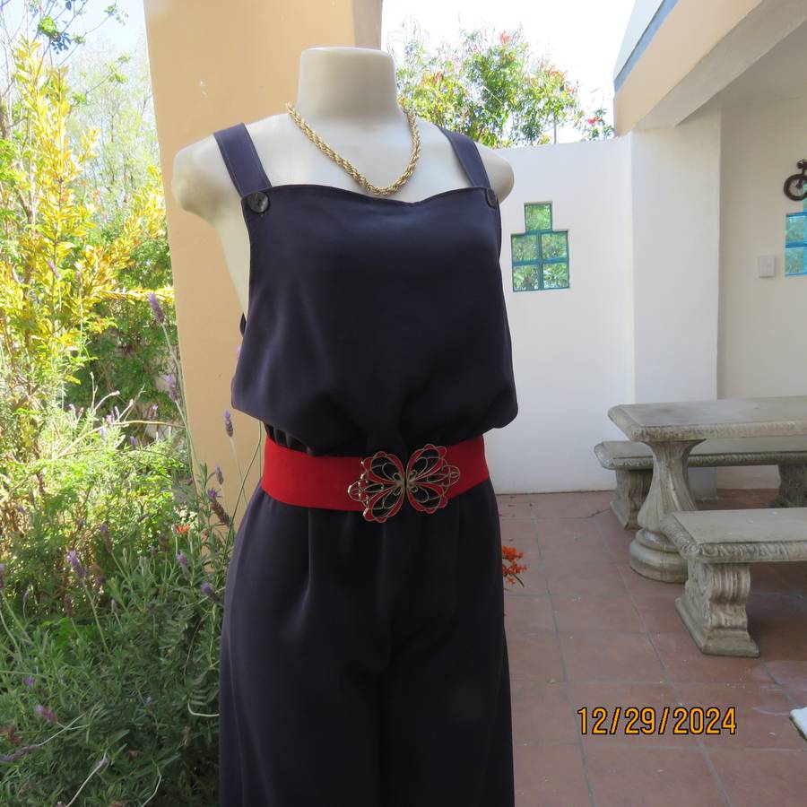 Boutique made dark navy polyester satin like pantsuit size 36. Shoulder straps. As new.