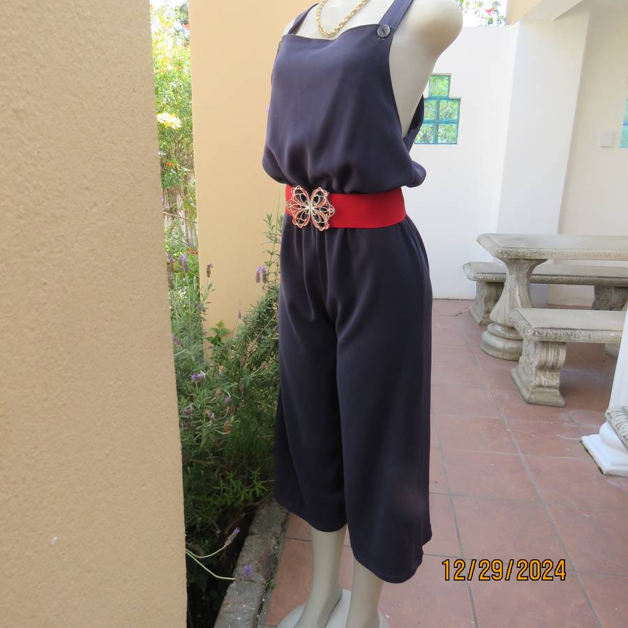 Boutique made dark navy polyester satin like pantsuit size 36. Shoulder straps. As new.