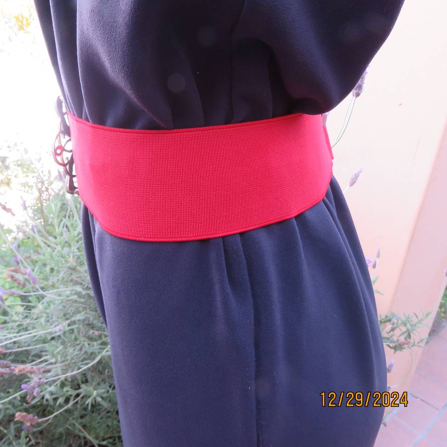 Boutique made dark navy polyester satin like pantsuit size 36. Shoulder straps. As new.