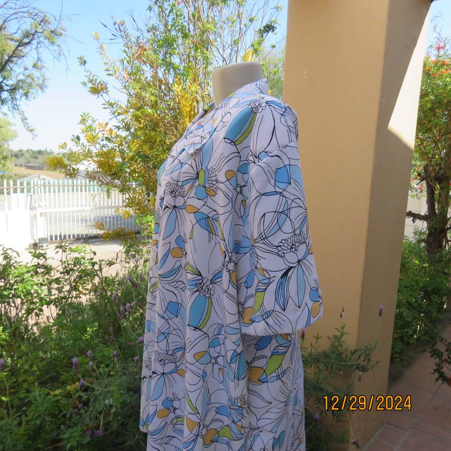 Beautiful CELLINI button down/open collar short sleeve top. Size 48/50.White/blue/peach floral.