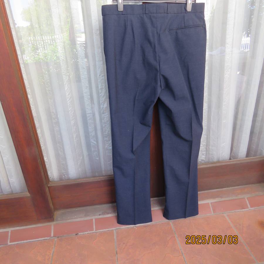 As new dark blue straight legged dress pants size 38 by ENSIGN Clothing. Side pockets. 1 at back.